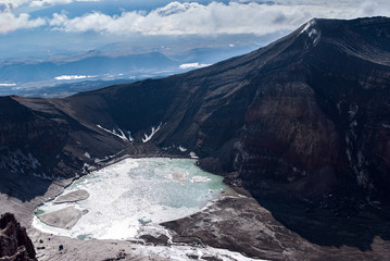 view of the volcanic lake, volcano crater, the summit of the mountain of the volcano, the view from the top