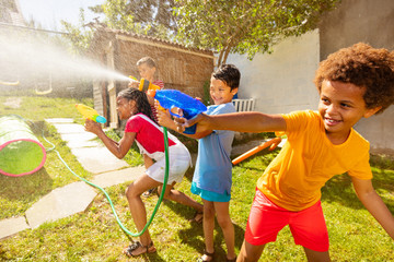 Boys in the middle of water gun fight action game