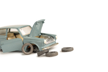 toy car with removed tires, tire and car repair service