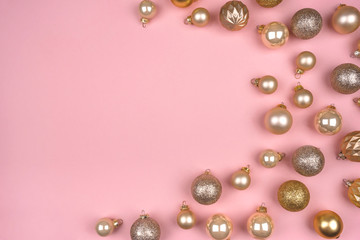 Fototapeta na wymiar Festive pink background with gold and silver christmas balls. Flat lay, top view. Copy space for your text.