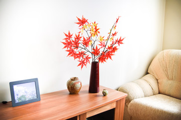 Interior decor - a vase with autumn leaves