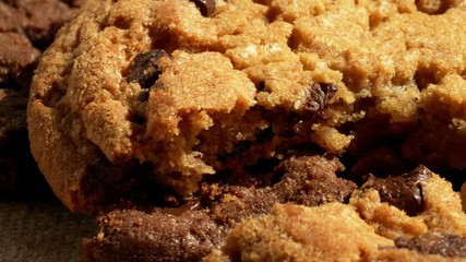 Extreme close-up shot of fresh-baked pastry. Appetizing American cookies with melting chocolate chips