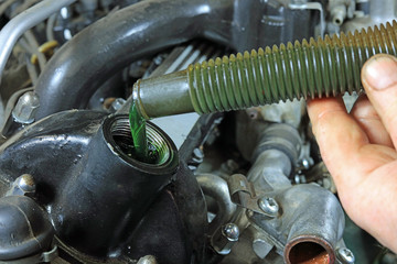 Adding Engine Oil To A Classic Motor Car.