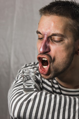 male alcoholism. drinking father, a man drinks vodka. feeling unwell. assault, booze at home. stop...