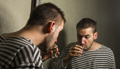 male alcoholism. drinking father, a man drinks vodka. feeling unwell. assault, booze at home. stop alcohol