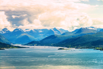 Aerial day view of beautiful fjord with snowy mountains in summer in Molde, Norway