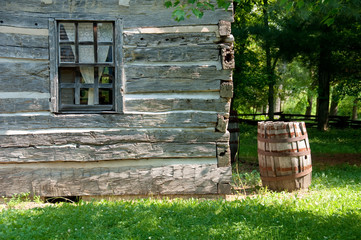 Log Cabin and Wooden Rain Barrel