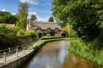 Beck Isle museum thatched roof cottage on the Thornton Beck in Thornton Dale North Yorkshire England