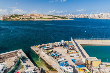 Naklejka na ściany i meble Fort Manoel (left) and Sliema town (right) viewed from Valletta, Malta