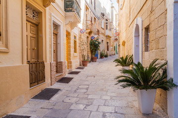 Fototapeta na wymiar Typical narrow street in Birgu town, Malta