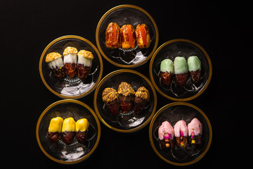 various dates on shiny crystal plates with golden design