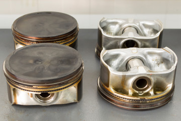 Four old pistons