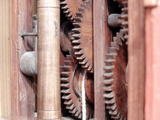 Wooden clock gears close up.