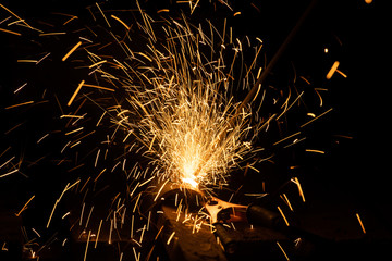 Closeup view of hot sparks while metal welding