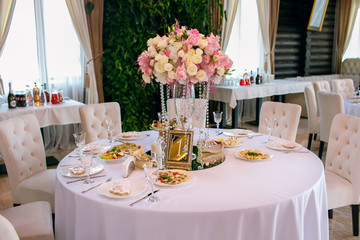 table in the restaurant, served, lots of chairs, large company