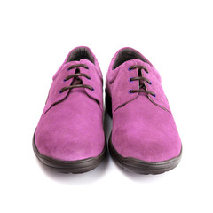 Pair of pink shoes isolated on white background, top view.