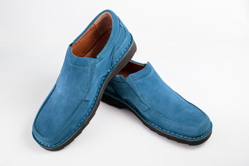 pair of blue shoes isolated on white background, top view.