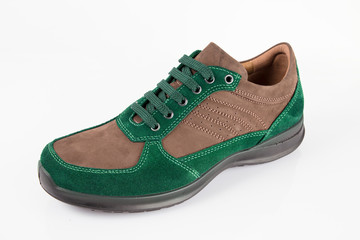 Male green and brown leather shoe on white background, isolated product.