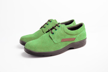 Male green leather shoe on white background, isolated product.