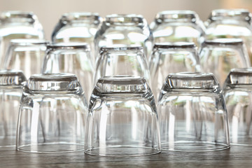 Set of empty glasses on wooden table