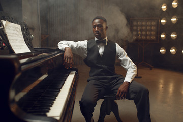 Ebony grand piano player, jazz performer