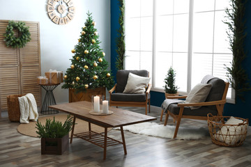 Beautiful interior with decorated Christmas tree in living room