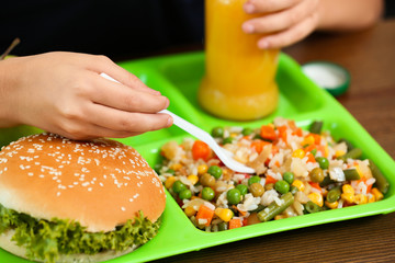 Child with healthy food for school lunch at desk, closeup
