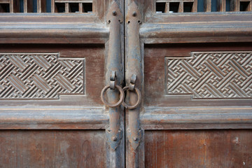 Traditional Chinese Residences interior wooden door and metal door ring in Tianshui Folk Arts Museum Hu Shi folk house, Gansu China