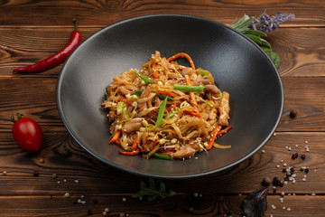 tori udon fried wheat noodles with chicken and vegetables and soy sauce