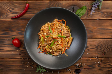 tori udon fried wheat noodles with chicken and vegetables and soy sauce