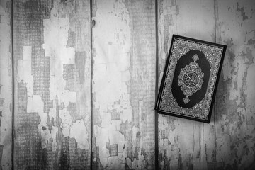 Koran - holy book of Muslims ( public item of all muslims ) on the table , still life .