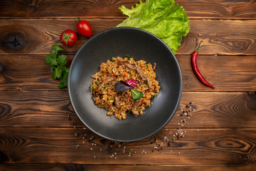 beef tahan fried Japanese rice with vegetables and slices of beef