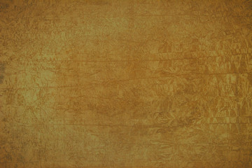 Background of ocher color on rough surface