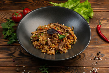 beef tahan fried Japanese rice with vegetables and slices of beef