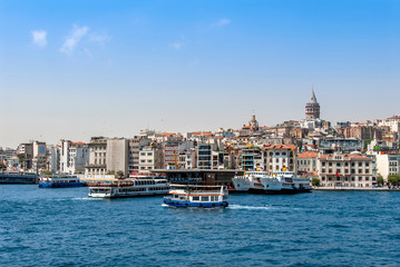 Fototapeta na wymiar Istanbul, Turkey, 29 June 2019: Karakoy Galata Port, Galata Tower and city ​​lines ships.