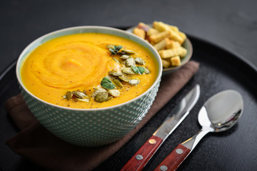 Pumpkin soup with seeds and croutons