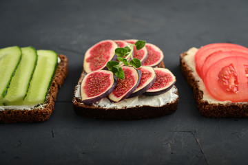 Vegetarian sandwich with cucumber, tomato, figs and avocado