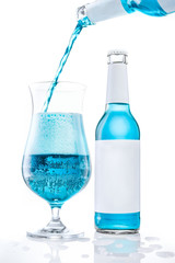 Exotic beer mix drink pouring in a glass. White background