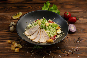 Caesar San Salad of Romano leaves, chicken, cherry tomatoes, egg, breadcrumbs, Parmesan cheese, Caesar sauce and tobiko