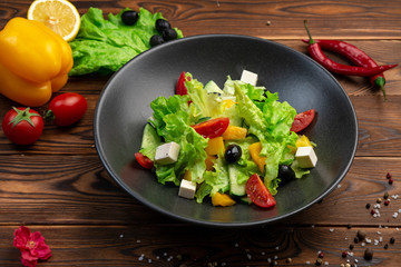 Light vegetable salad. Fresh Cherry, Cucumbers, Bell Peppers, Romano, Olives, Feta Cheese, Olive Oil