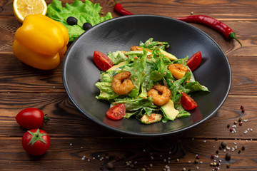 Tiger shrimp and avocado salad with spinach, iceberg and tobiko caviar with light creamy sauce