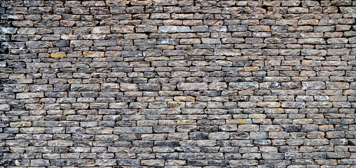 Perfect dry stone wall panoramic background.