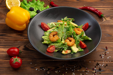 Tiger shrimp and avocado salad with spinach, iceberg and tobiko caviar with light creamy sauce