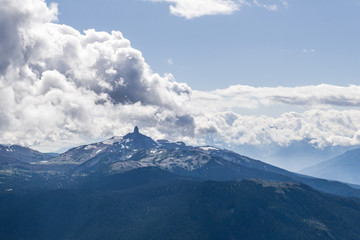 blackcomb mountain peak panorama view cloudy sky summer time.