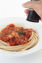 Studio macro Spaghetti bolognese on a white plate