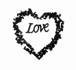 The letters are made of red, green sponge. The word love on a white background.