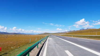 Beautiful landscape view of blue sky and high way road in Qinghai China