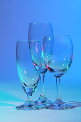 Wine glasses against colourful background