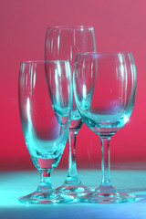 Wine glasses against colourful background