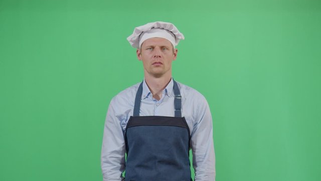 Bad Smeling Hands Expressed By A Adult Man Cook. Studio Isolated Shot Against Green Screen Background